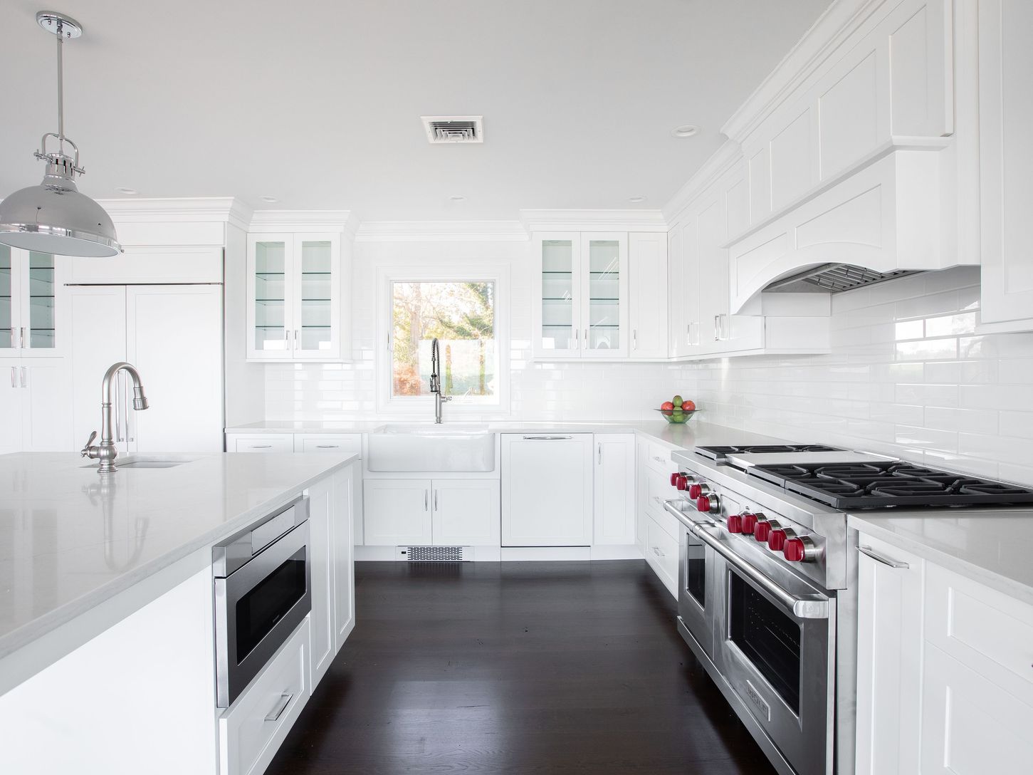  Bright white kitchen with hi end stainless appliances to satisfy the skillful cook 