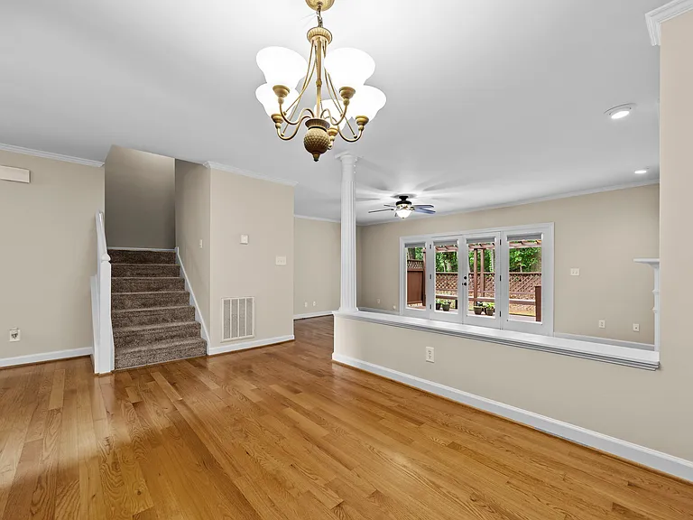 Dining area connects seamlessly to the living room, staircase, and main-level living spaces.