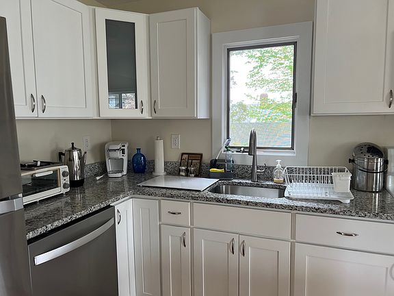 Kitchen with dishwasher, full size refrigerator