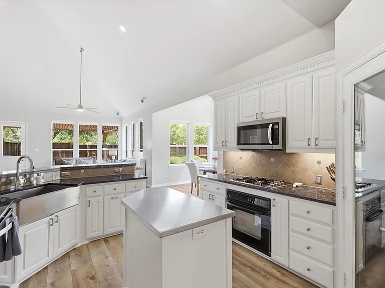 Chef's Dream kitchen with gas stove, plenty of counter prep space, and walk-in pantry