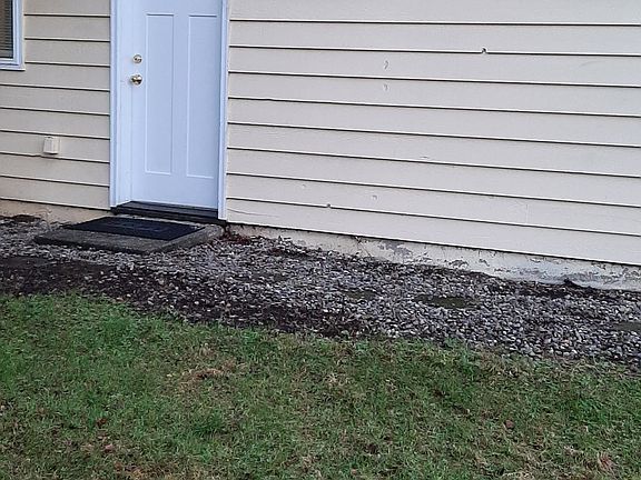 Entry door to unit B is ground level and on the east side of the building.