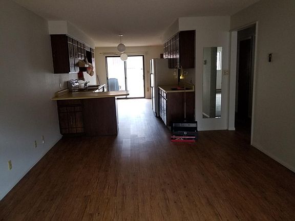 Open living Room / Dining Room with new flooring. Sliding gl