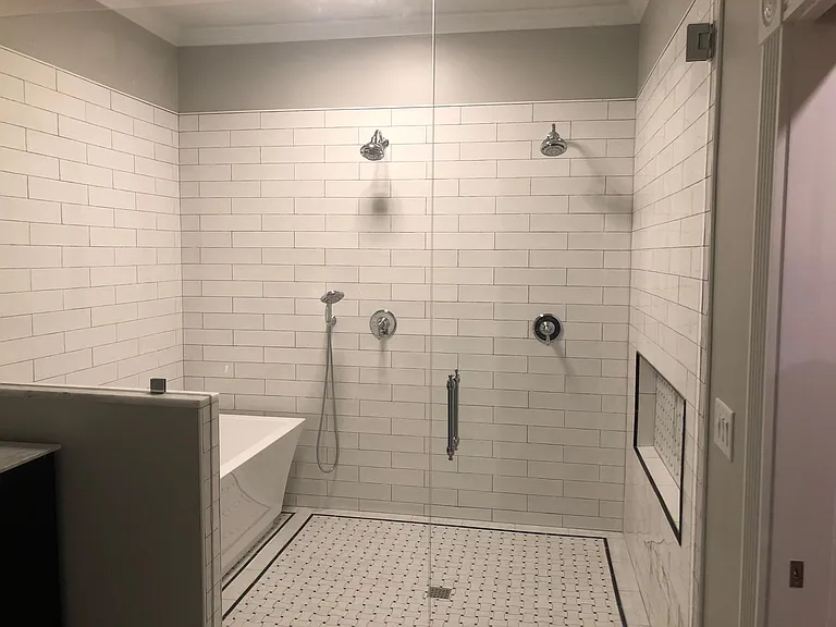 Luxurious Bathroom - Double Shower and Soaking Tub with Glass enclosure