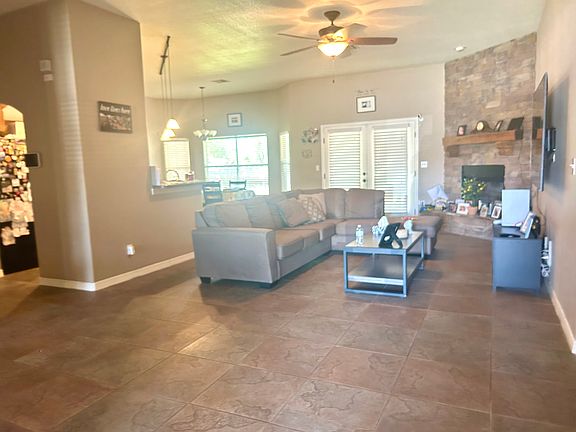 Open living area with stone fireplace.