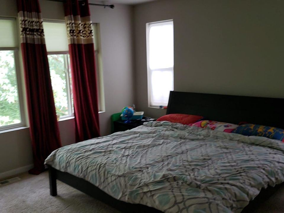 Master bedroom with a beautiful view of Tambark Creek trail. Wake up to freshness!