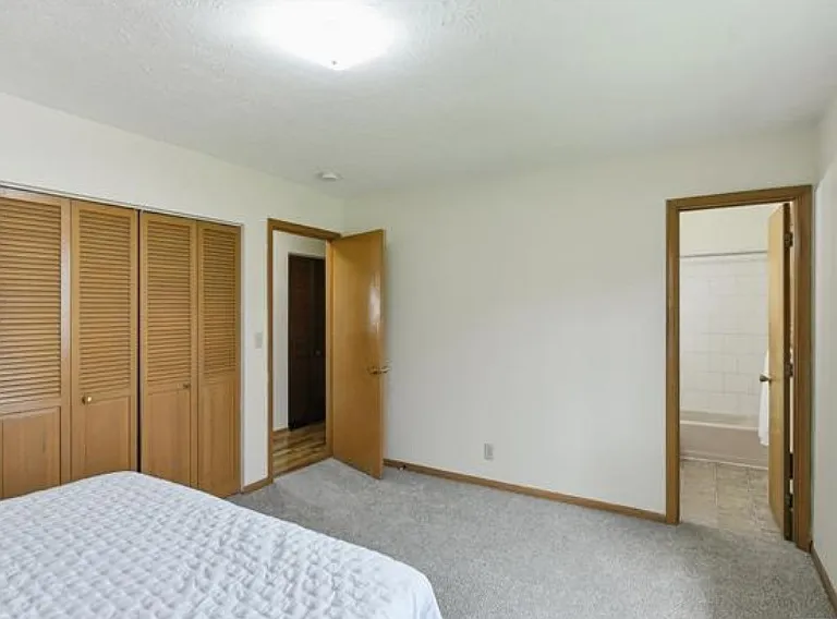 Primary bed with private bathroom and dual closets
