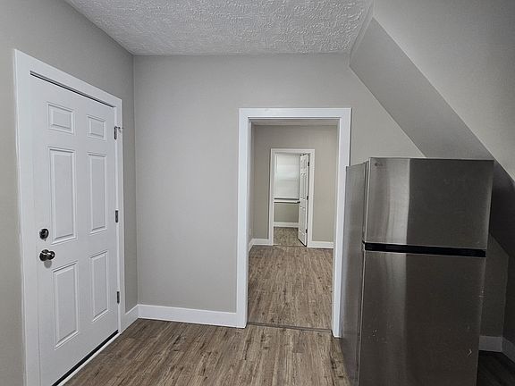 View of front door and entrance to the living room.