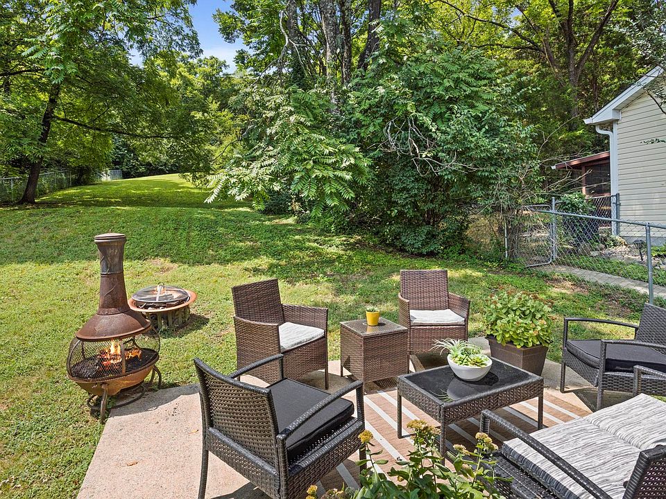 Beautiful Backyard with Seating and a fire pit