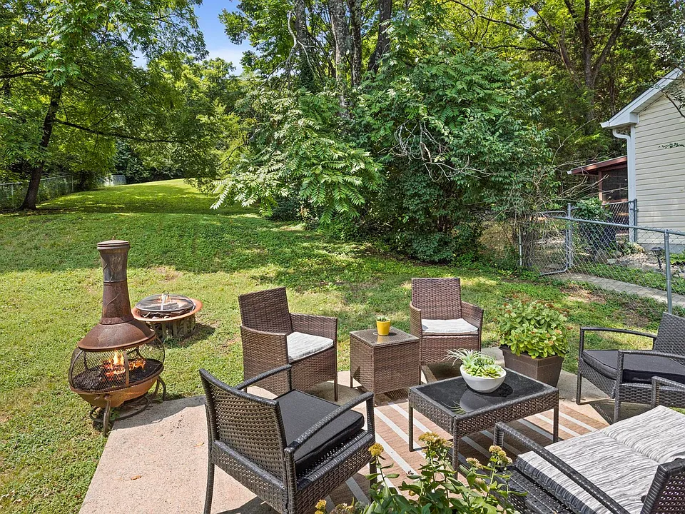 Beautiful Backyard with Seating and a fire pit