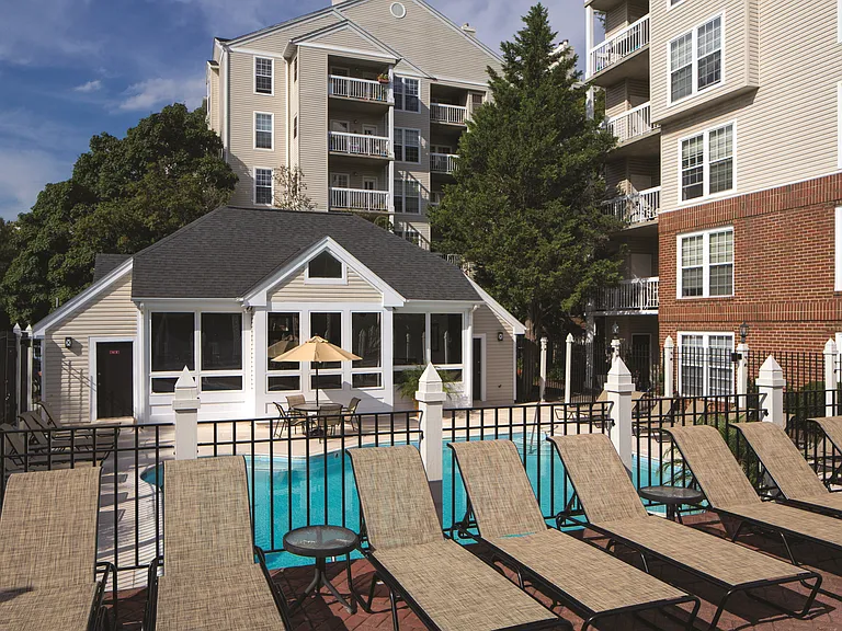 Sparkling Pool & Sundeck with Relaxing Lounge Chairs