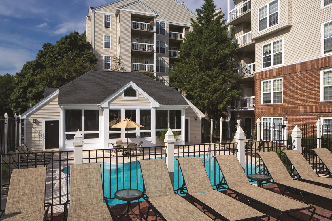 Sparkling Pool & Sundeck with Relaxing Lounge Chairs