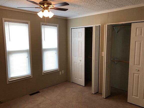 Second Bedroom showing huge closets, great windows for natural light & ceiling fan.
