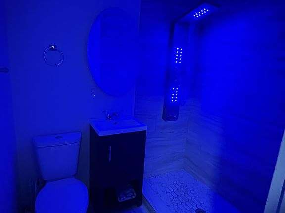 upstairs unit bathroom - standing shower with shower lights