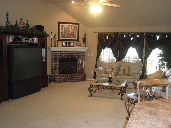 LIVING ROOM/CORNER F.P.