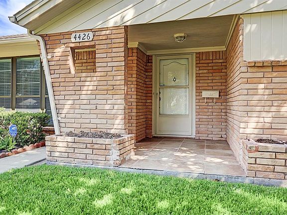 Entry has a tiled front porch.