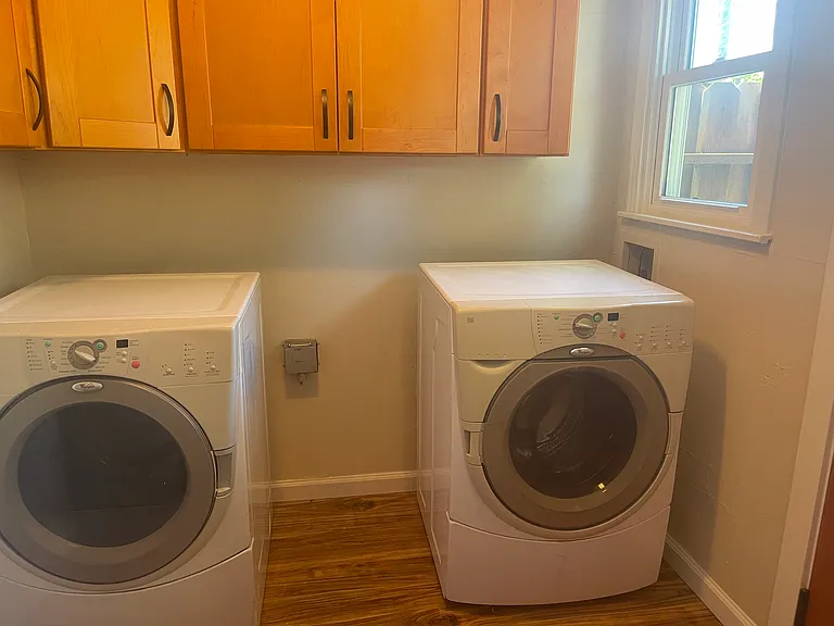 Laundry room with storage cabinets