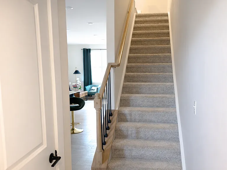 Stairs leading to the bedroom level