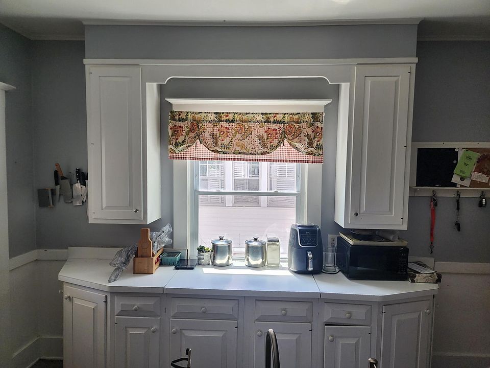 Kitchen window overseeing driveway.