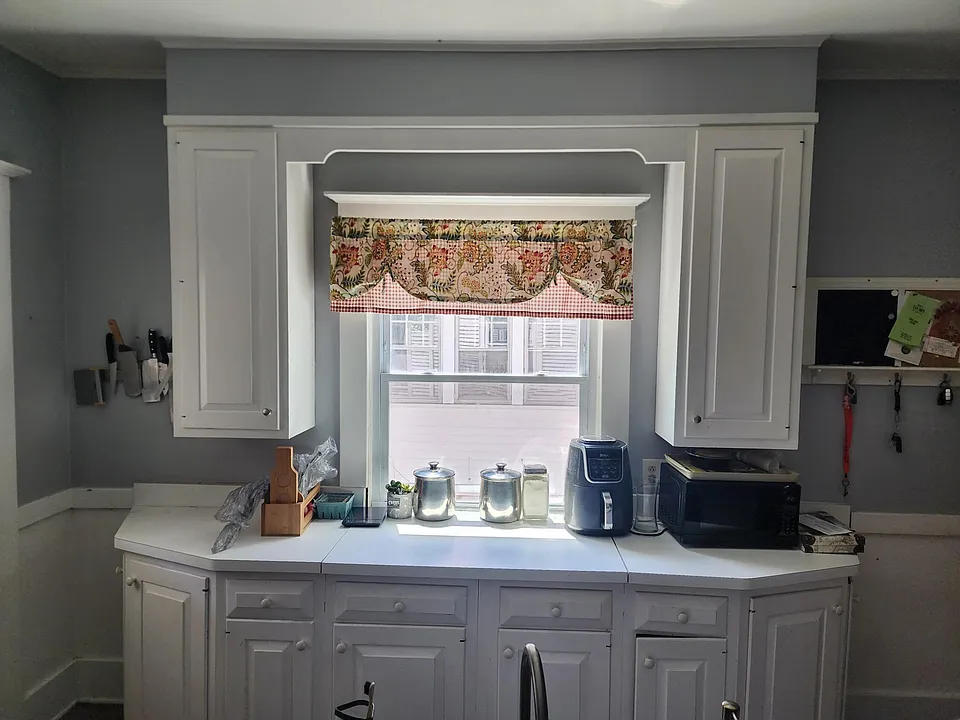 Kitchen window overseeing driveway.