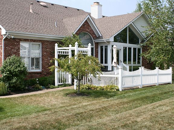 Backyard w/fenced patio & arbor
