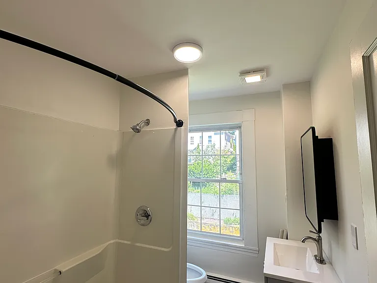 Full bathroom with clean, updated finishes