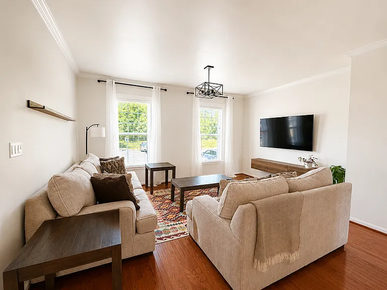 Bright, Spacious Living Room with Comfortable Sofa Seating