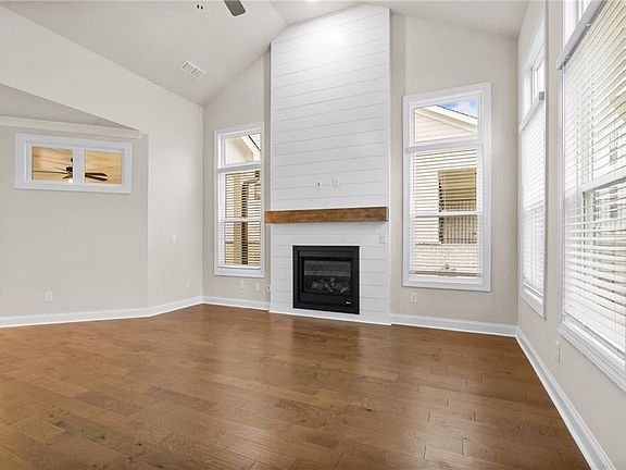 Plenty of floor space in this family room. Photo is not of actual home but a previously buiilt home