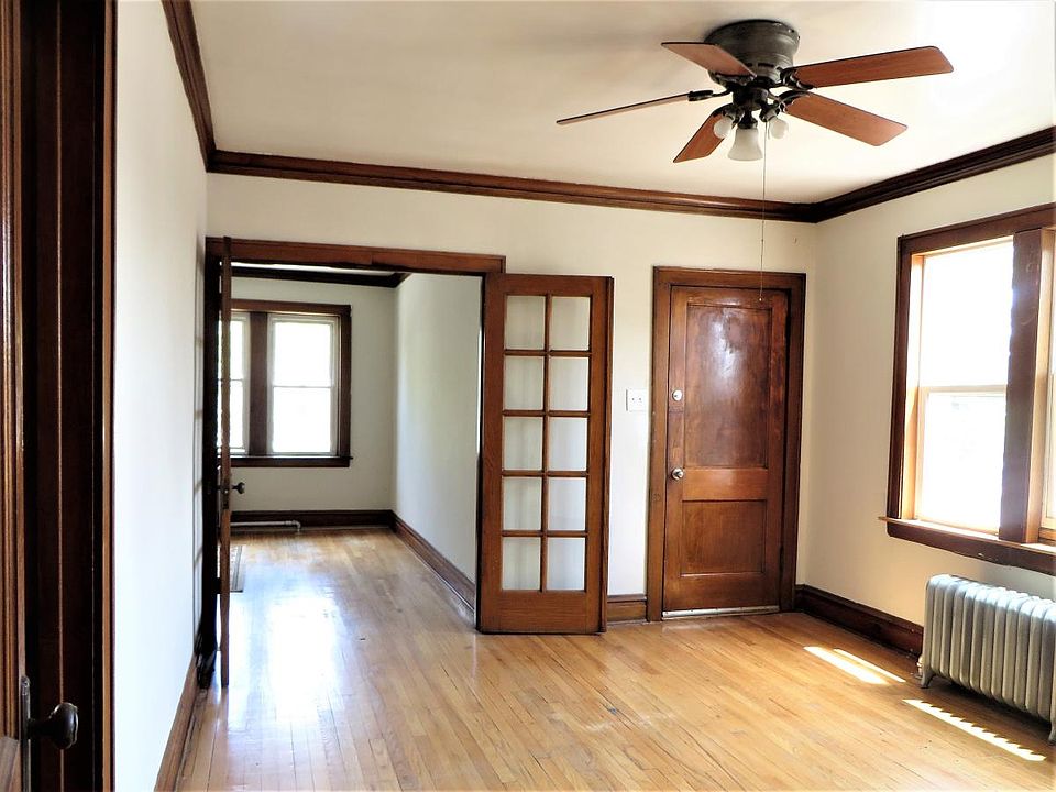 Entry and Dining Room with View Into Living Room