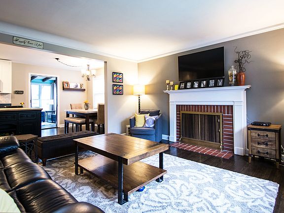 Living Room area with hardwood floors, opens to Kitchen/Dining