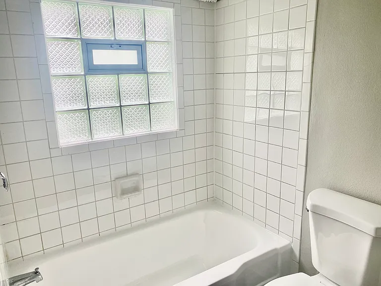 Full bathroom with tub