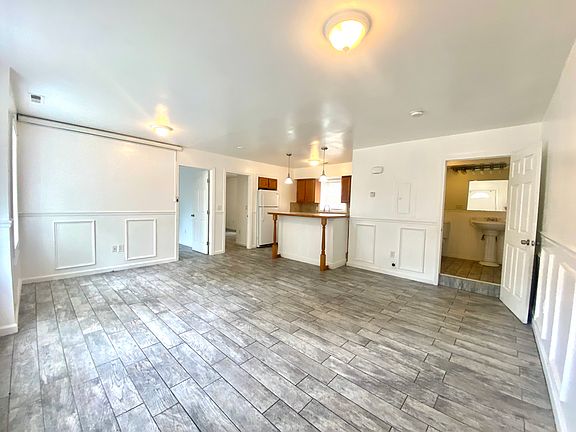 Spacious Bright open floor plan, tile flooring, accent panels, kitchen island