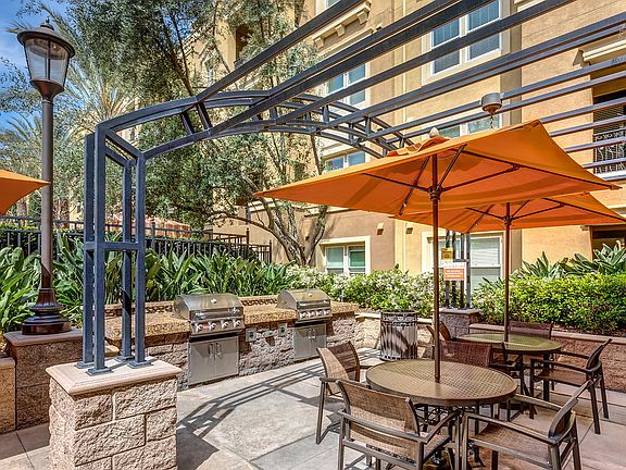 BBQ area with tables and chairs.