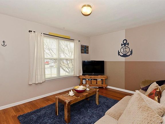 Family room with wood flooring