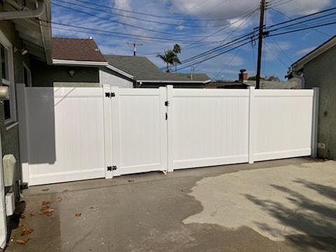 Driveway view of new fence