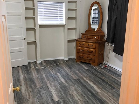 New flooring, lighting, paint in back 
bedroom -- formerly where the carriage was parked.