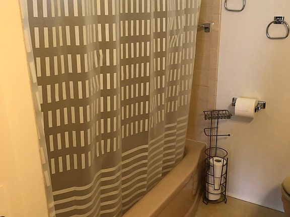 Upstairs bathroom with tub