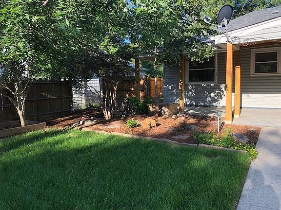 back yard, view from back gate and garage towards house