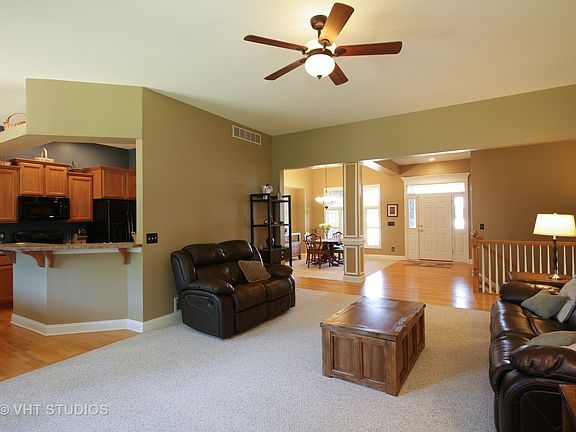 The large great room is open to the eating area and kitchen