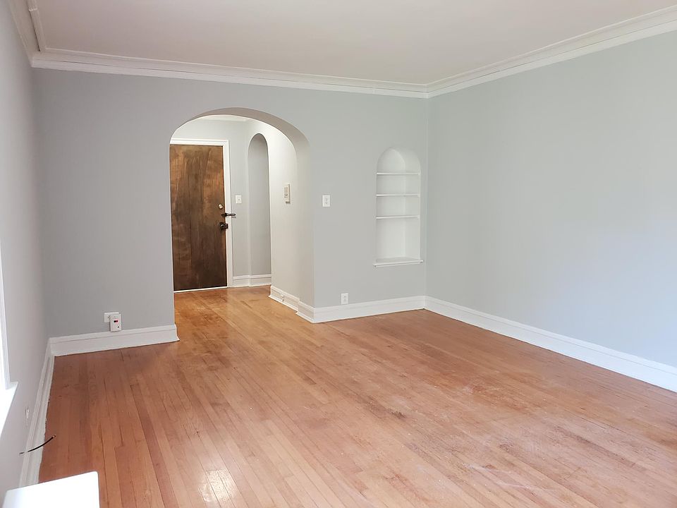 living room with built in bookshelf