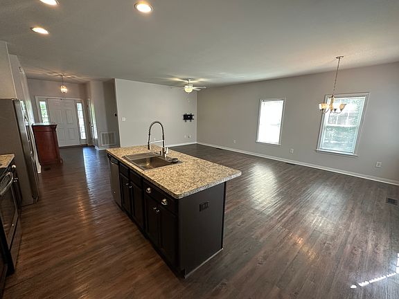 Open floorplan from kitchen to living room and dining area