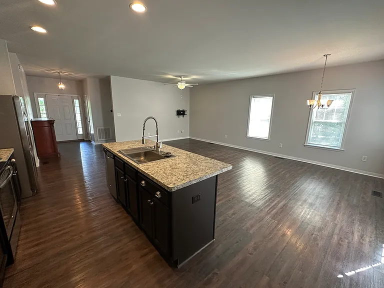 Open floorplan from kitchen to living room and dining area