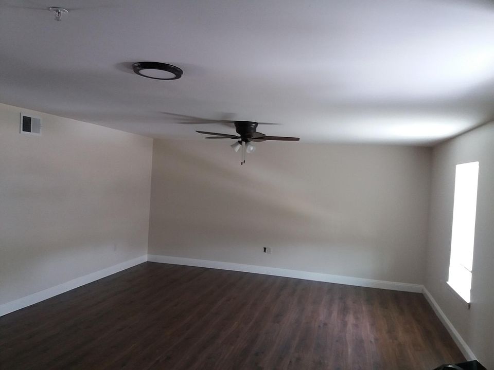 A view of the large living room front the front door