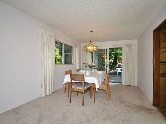 Dining area opens onto the private lush backyard