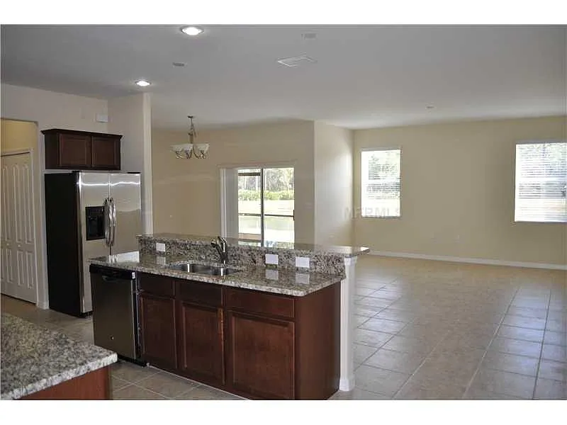First floor view of Family room, Dinning room and Kitchen. - 20315 Starfinder Way