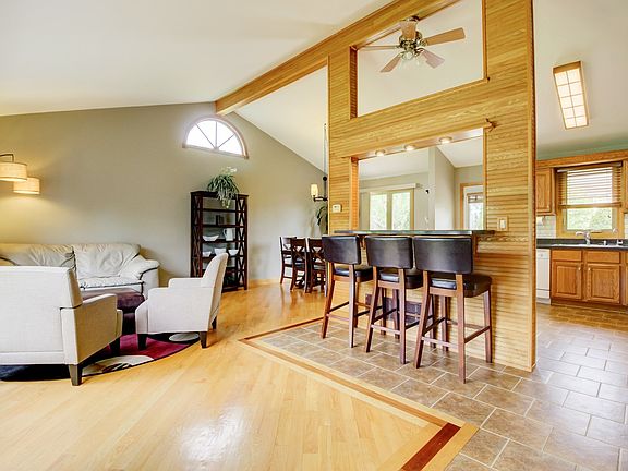 Open concept living room, kitchen, countertop seating