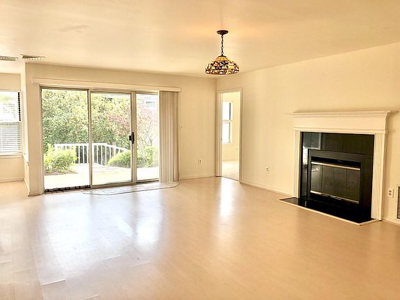 Spacious Living Room w/fireplace & sliders to private patio