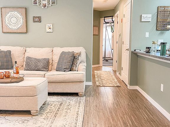 Living room has an open concept to kitchen and dining room
