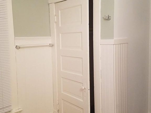 Bathroom closet next to the washer and dryer
