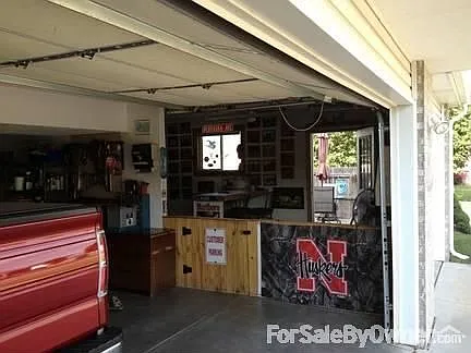 3 Stall Garage
						:
						large 3 stall, 220 service, Great man cave, door leads to large patio with shed.