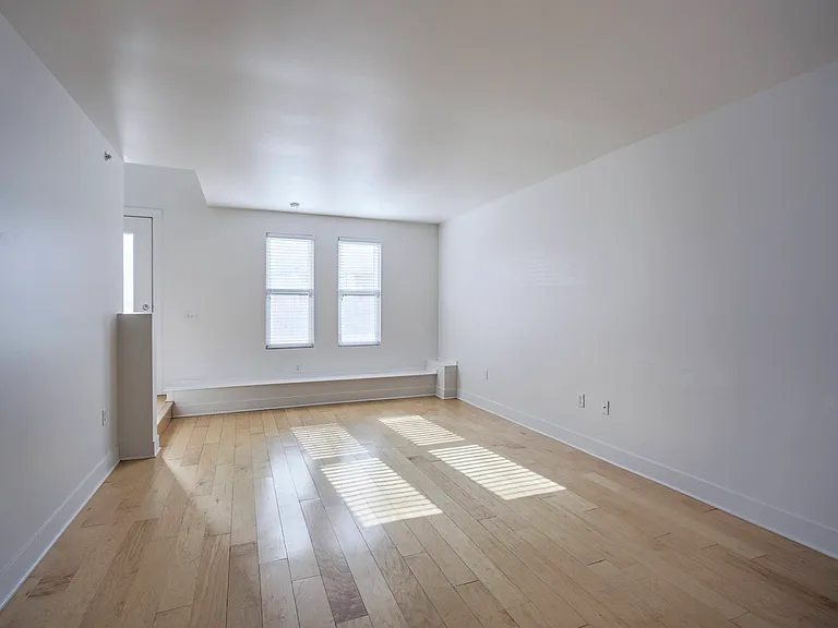 Front entrance and two large windows in a tonwhome at The Sawyer.